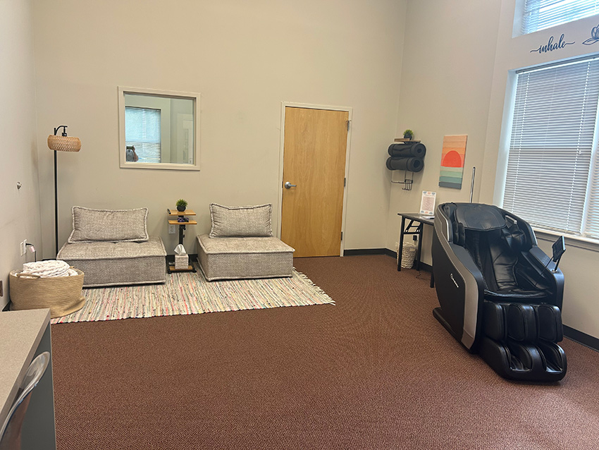 decompression room interior with two cushioned chairs and comforting lounge chair