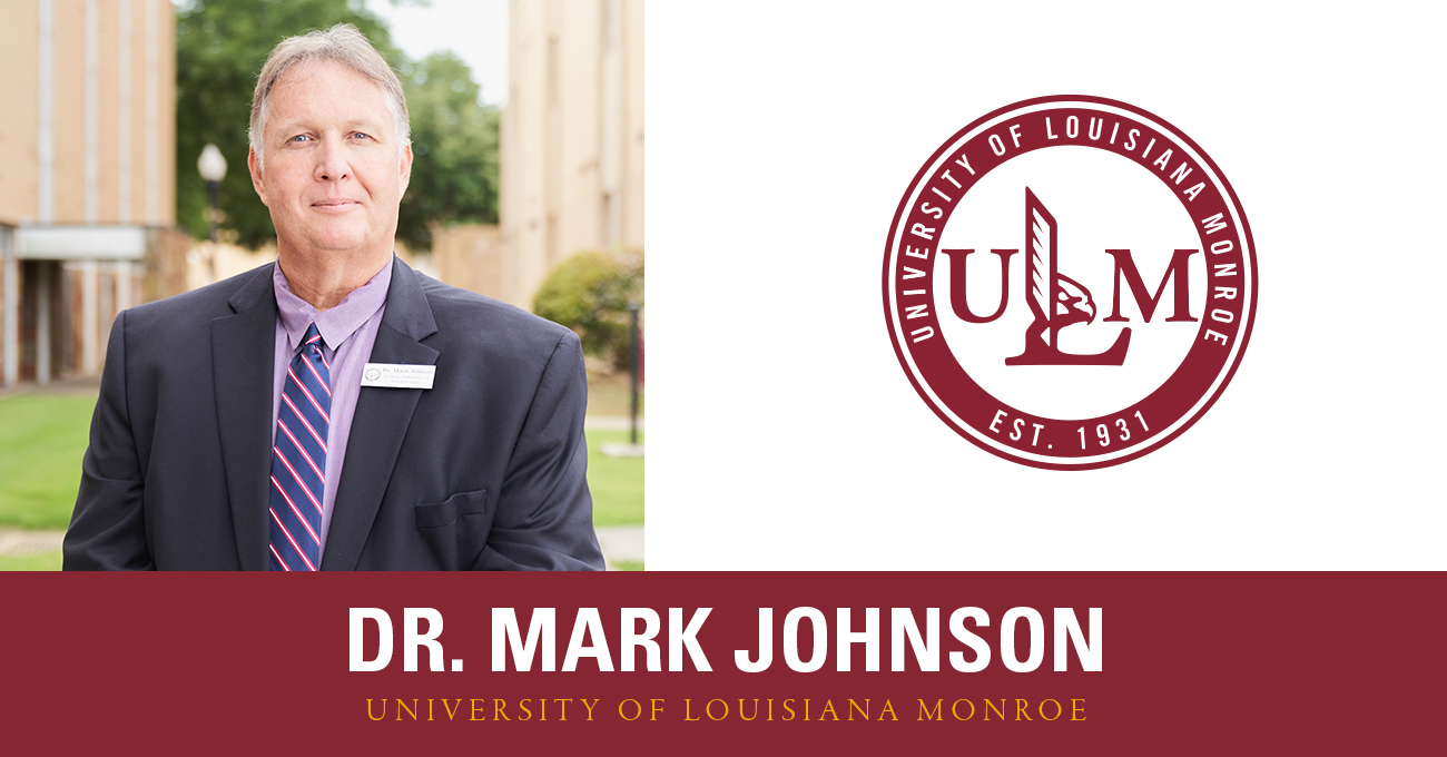 A man smiles at the camera. He is wearing a suit. Next to his picture is a graphic of the ULM logo.