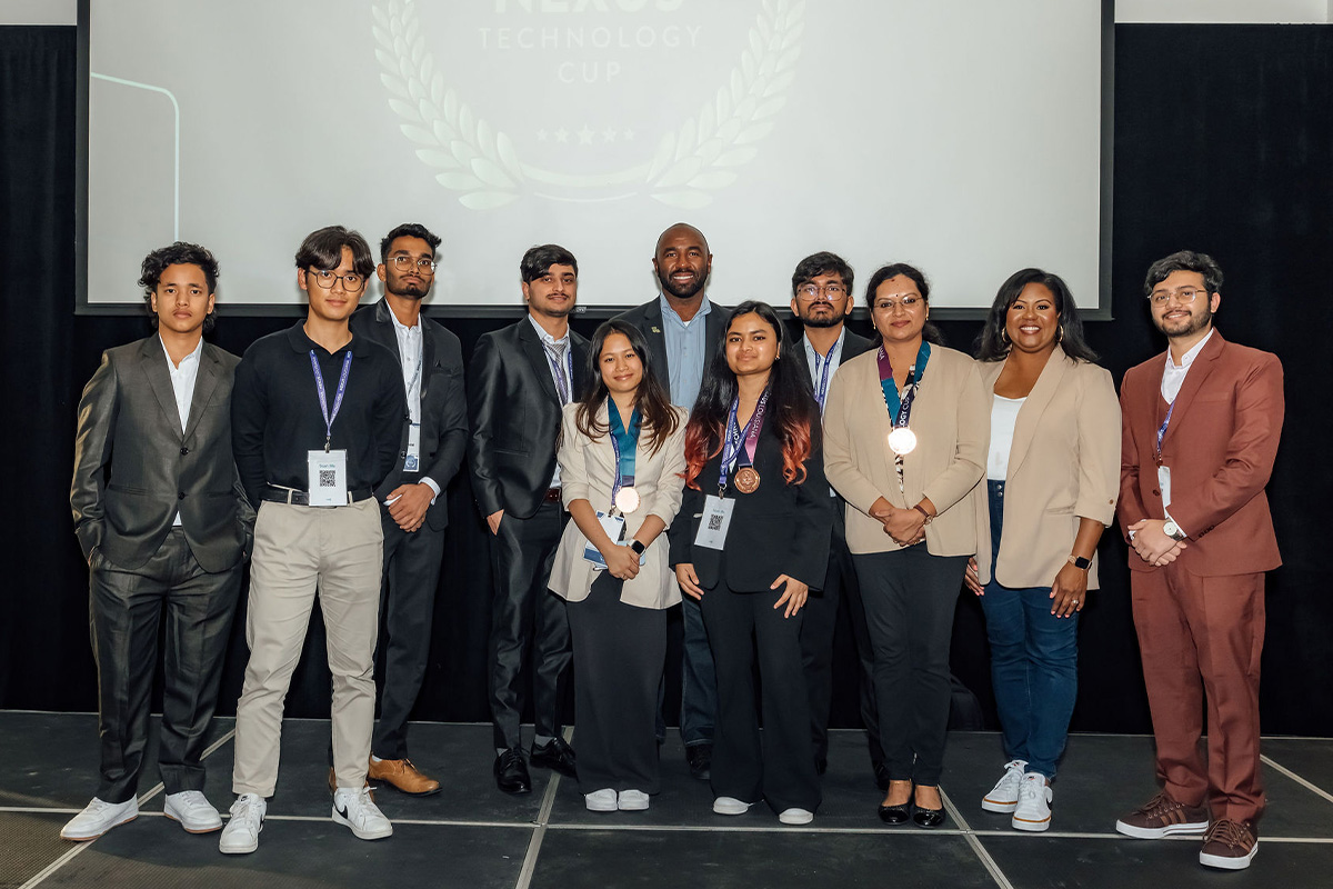 A group of people pose at the Nexus Technology Cup. 