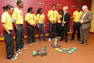 Photo of students and robotics
