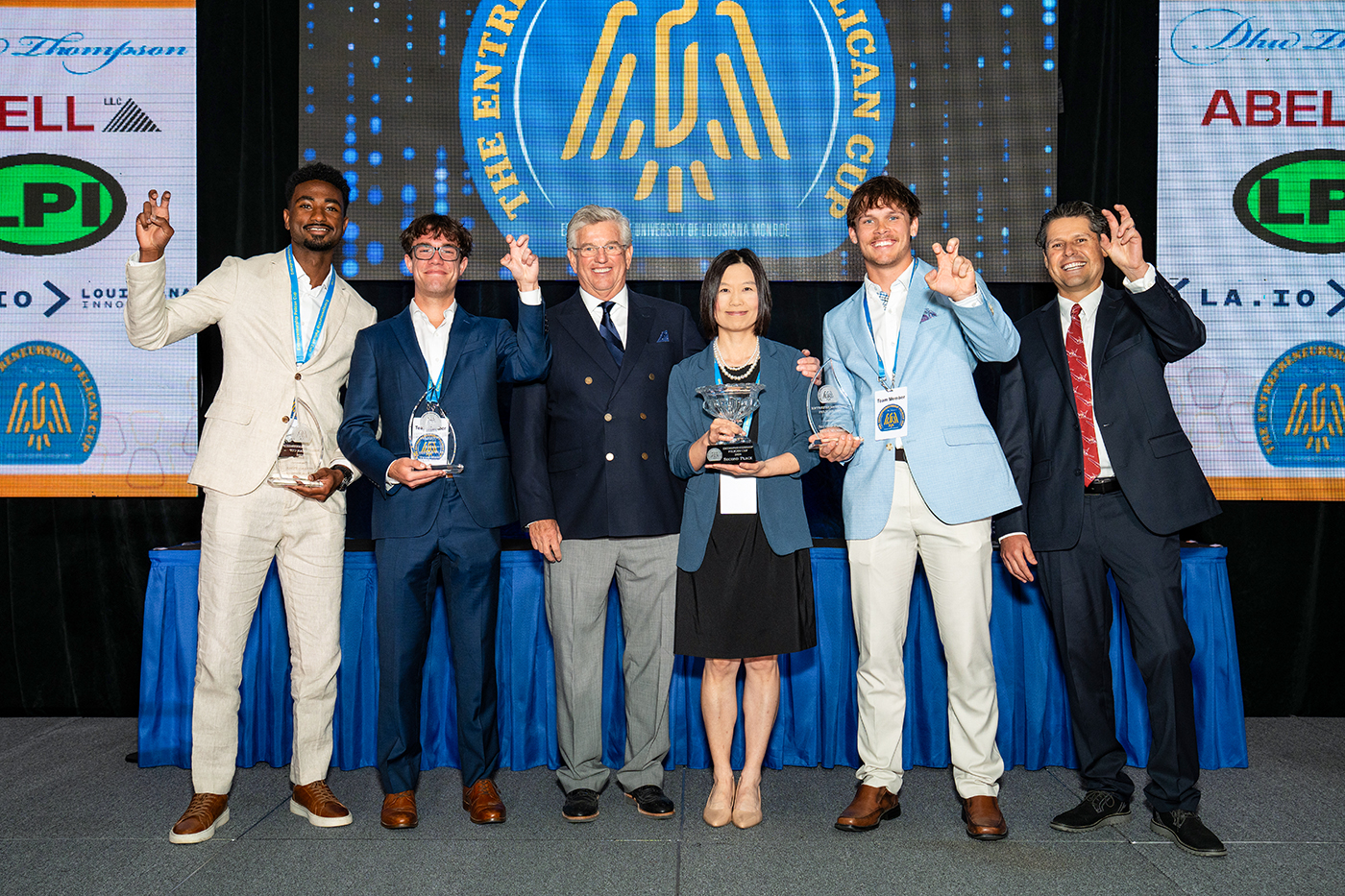 Hustlr - Pelican Cup Second Place 2026 The second-place prize of $25,000 in the Graduate Division was awarded to Hustlr, a team from ULM. Hustlr connects users with trusted workers from their own communities who are ready to work now, for tasks including yard work, moving, and others where extra labor is required. Hustlr features team leader Dylan Hayden, team members Chase Gunn and Nokia Masengu, and advisor Joyce Zhou.