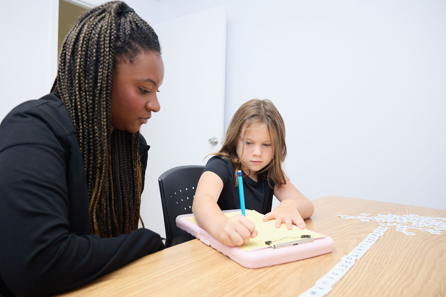 clinic staff working with a child